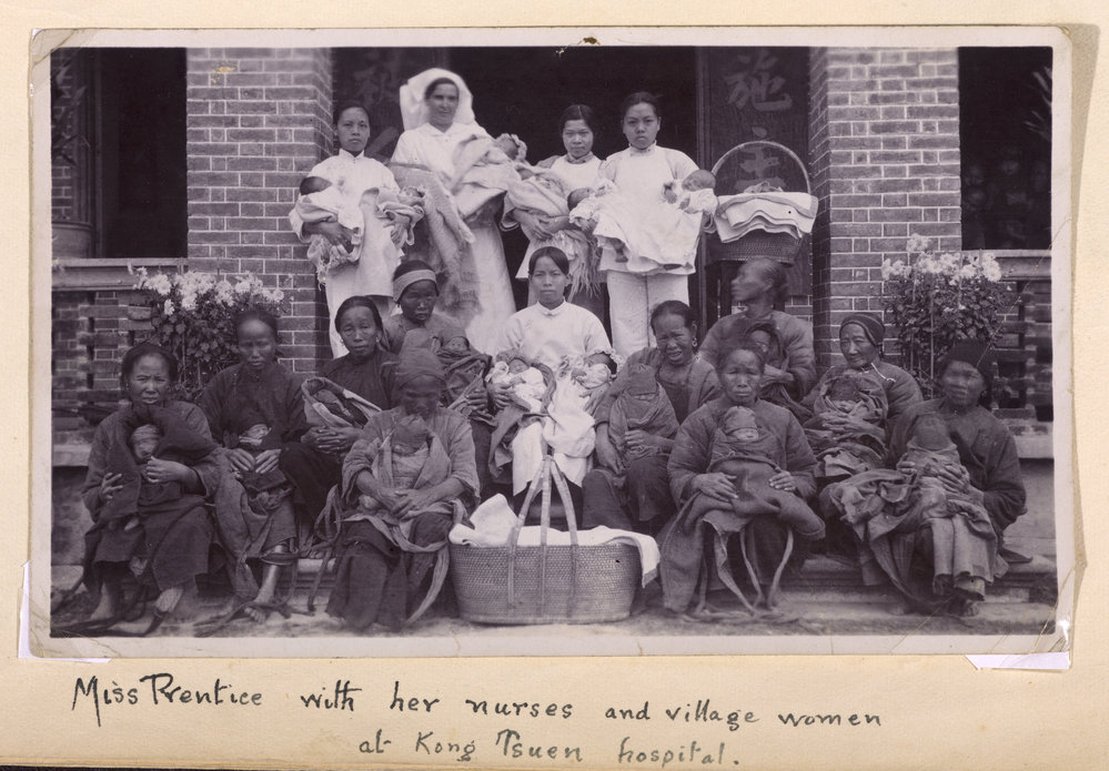 Nurses With Villagers And Babies.