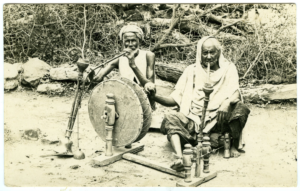 Two men spinning cotton
