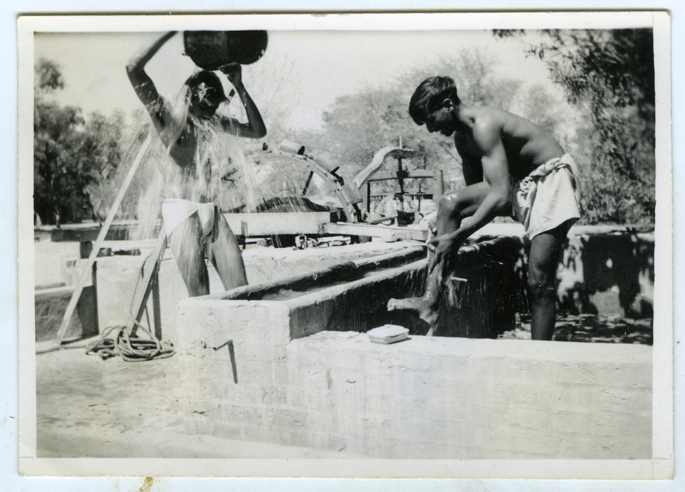 "Morning bath," unidentified men washing in the outdoors