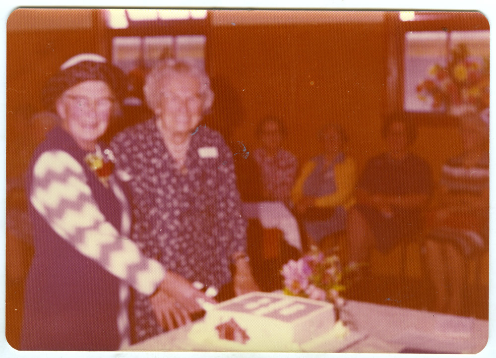 Mrs. Graham and Mrs. Crum cutting the 50th anniversary cake of St. Columba Women's Group, Christchurch
