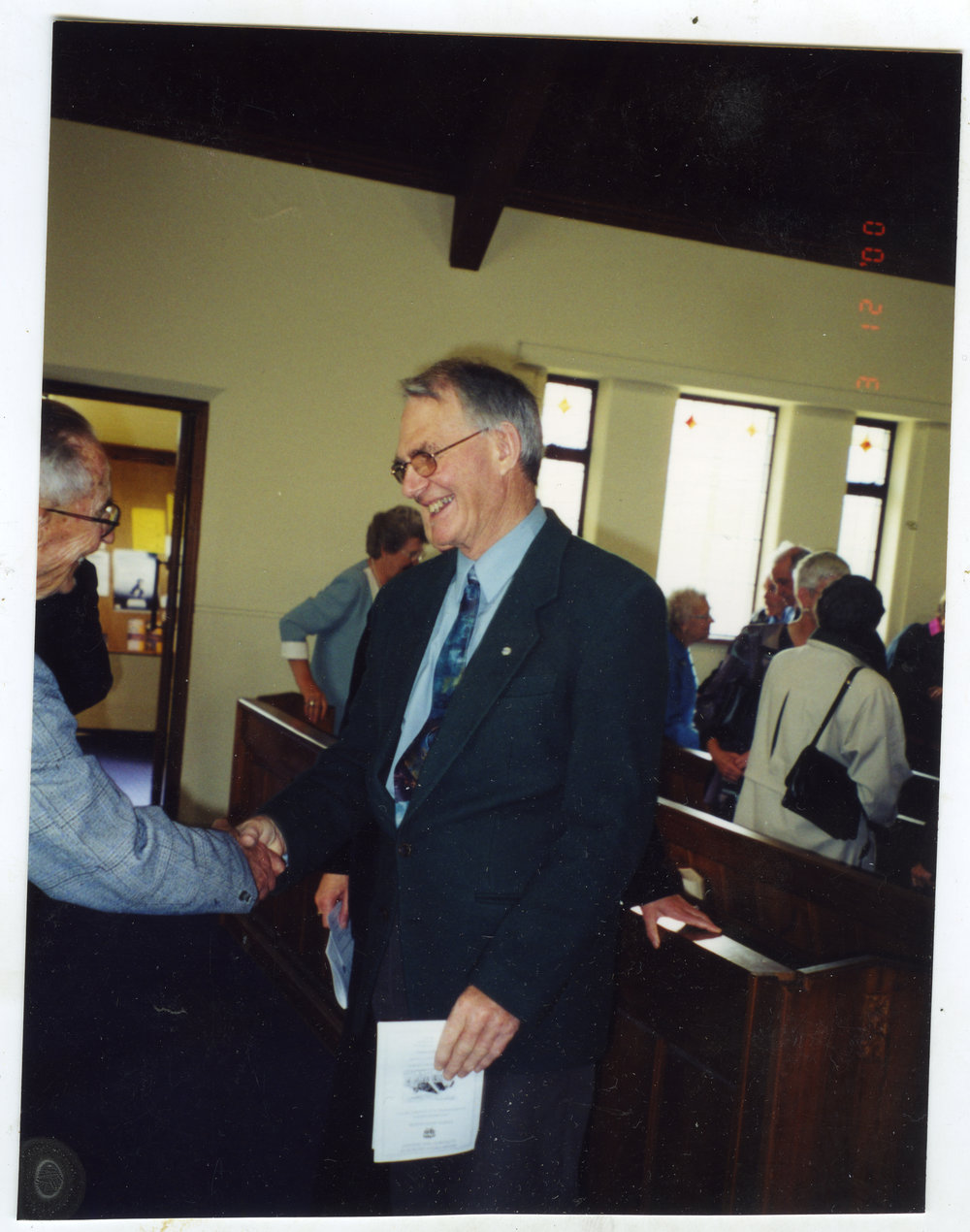Ian Lloyd, shaking hands with unidentified male, St. Columba, Christchurch