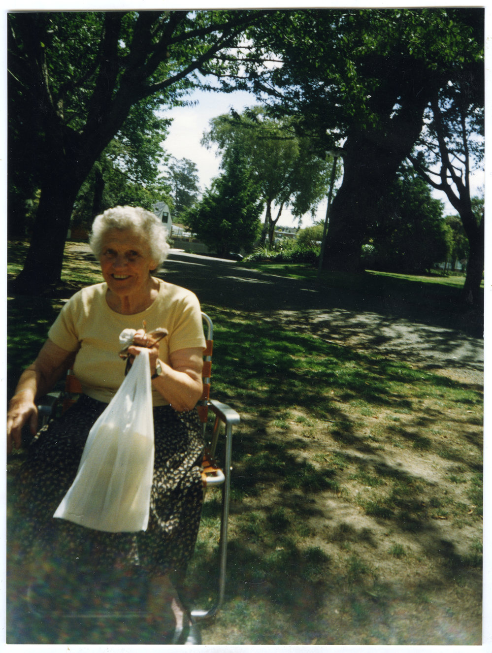 Georgina Shipley, sitting in a picnic chair, 1998