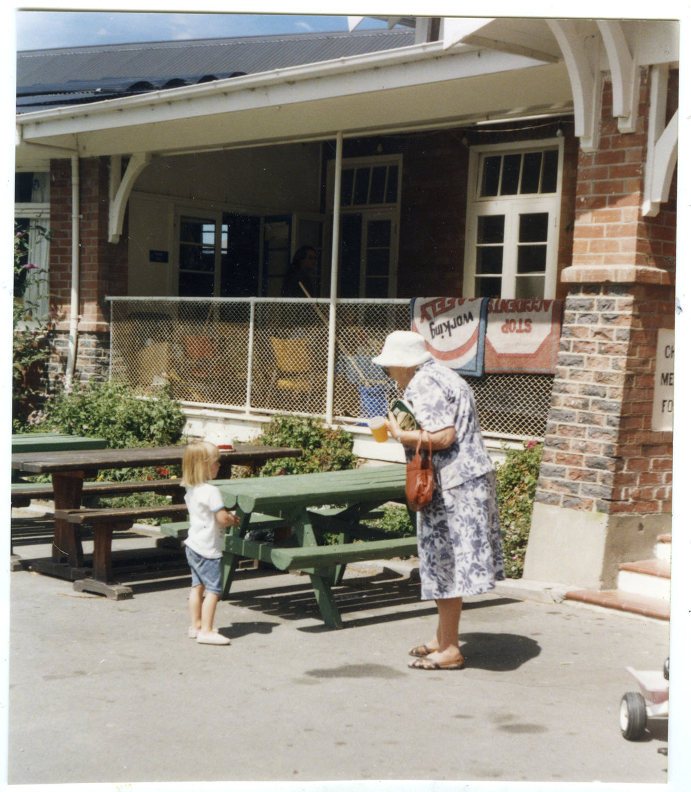 Viv Sinclair of St. Columba's Women's Fellowship speaking to an unidentified young girl at Cholmondeley Children's Home, 1999