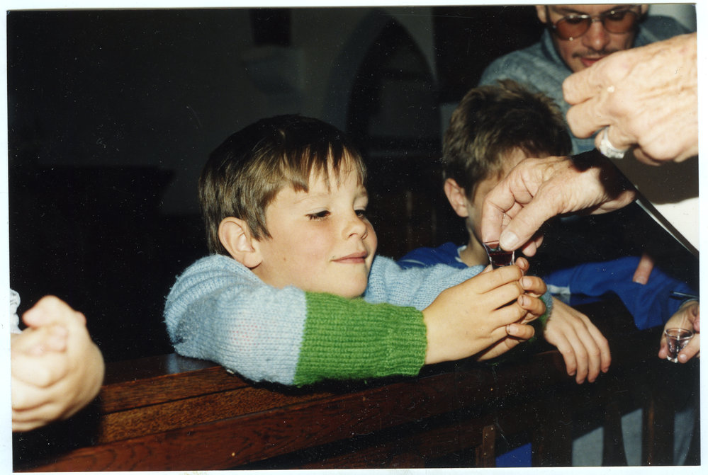 Young boy accepting Communion