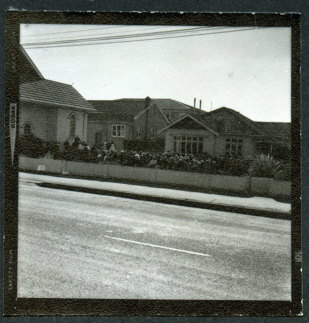 Distant photographs of the congregation seated outside John Knox Church, Rangiora, during their centennial celebration, 1972