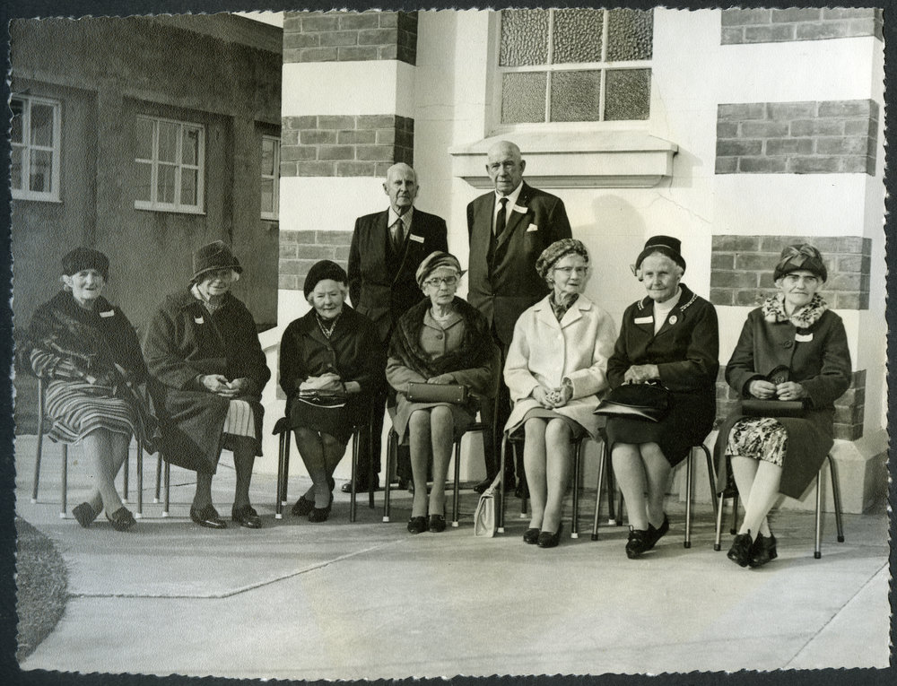 Seven unidentified women and two unidentified men during John Knox Church's centenary celebrations, 1972