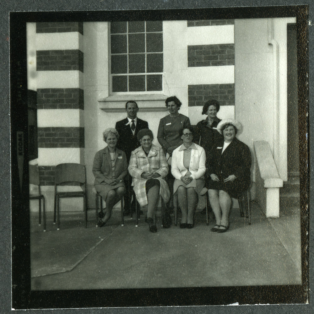 Seven unidentified women positioned on the steps of John Knox Church, Rangiora, 1972