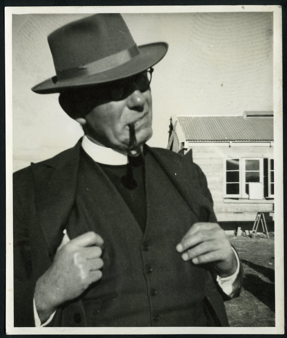 Unidentified minister smoking a pipe