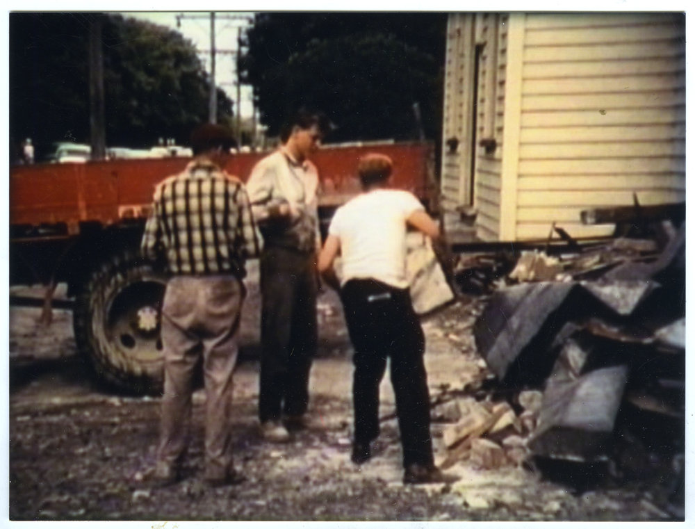 Three unidentified men with truckload of scrap