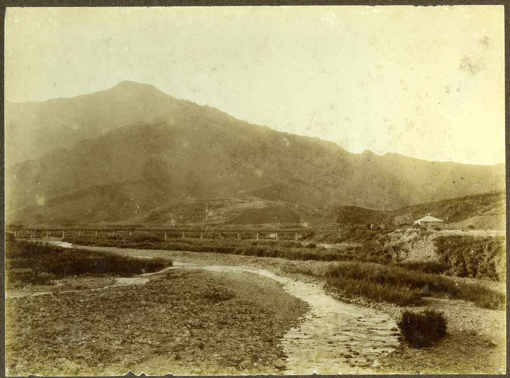 Unidentified river flowing under a bridge