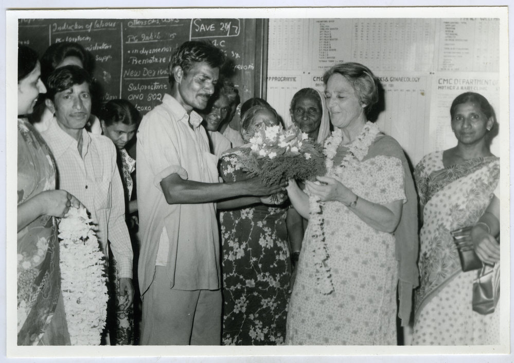 Beryl Howie accepting a bouquet of flowers from unidentified Indian man, Christian Medical College and Hospital, Ludhiana