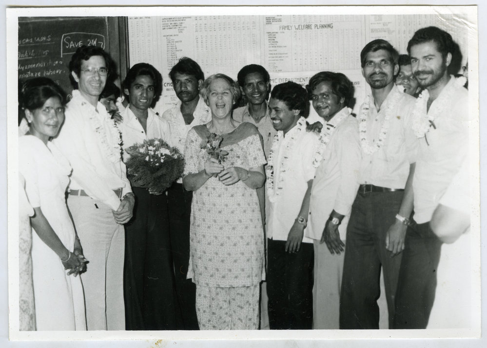 Beryl Howie stands among a group of unidentified Indian men, and one woman, Christian Medical College and Hospital