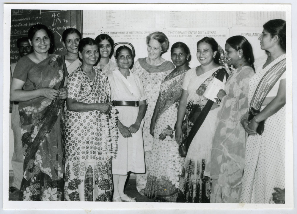 Beryl Howie stands among a group of unidentified women, one woman is wearing a nurses uniform, Christian Medical College and Hospital, Ludhiana
