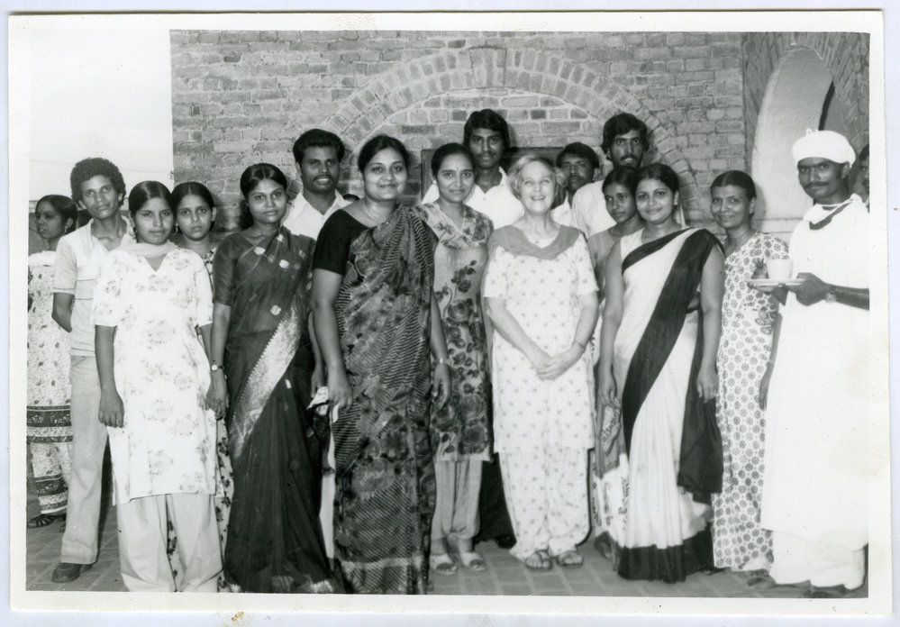 Beryl Howie stands among a group of unidentified Indian men and women, Christian Medical College and Hospital, Ludhiana