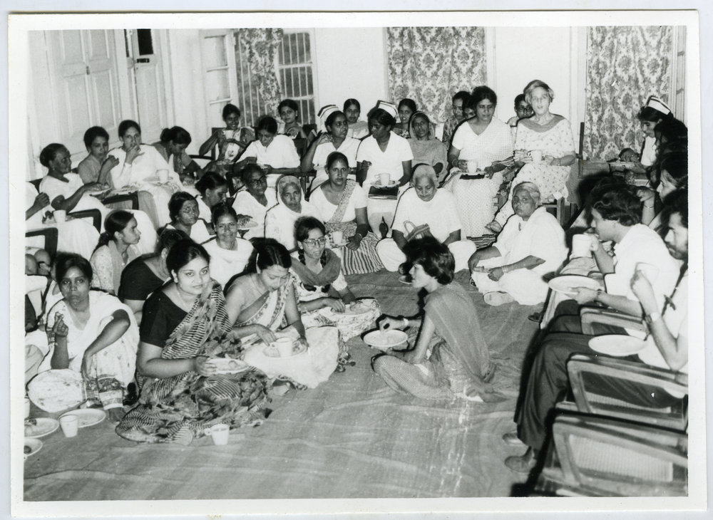 Beryl Howie and group of unidentified women and men sit in a circle enjoying a refreshment, Christian Medical Hospital, Ludhiana