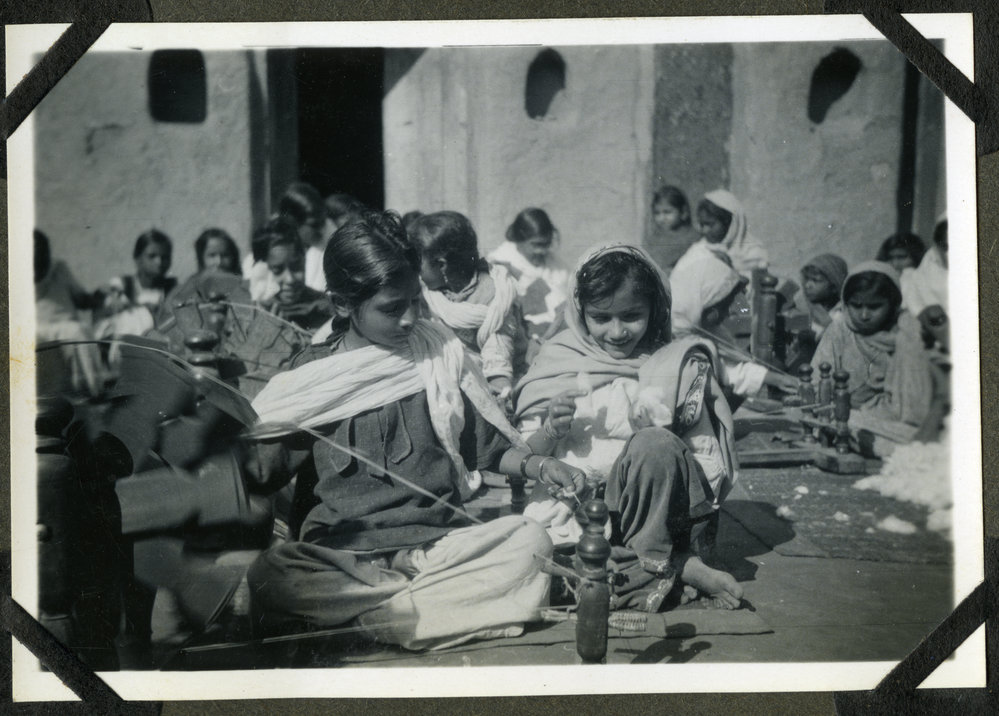 Two unidentified young women spinning thread during class, Jagadhri Girls' School, 1941