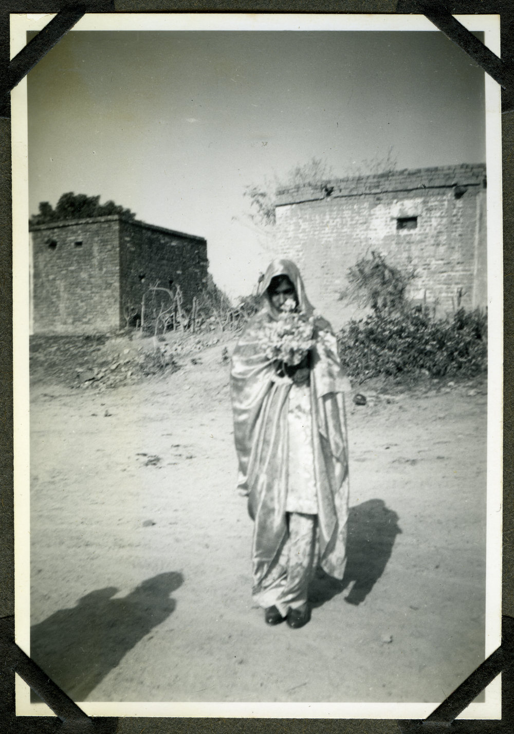 "Wedding Groups," an unidentified woman walks with a bouquet during a wedding ceremony