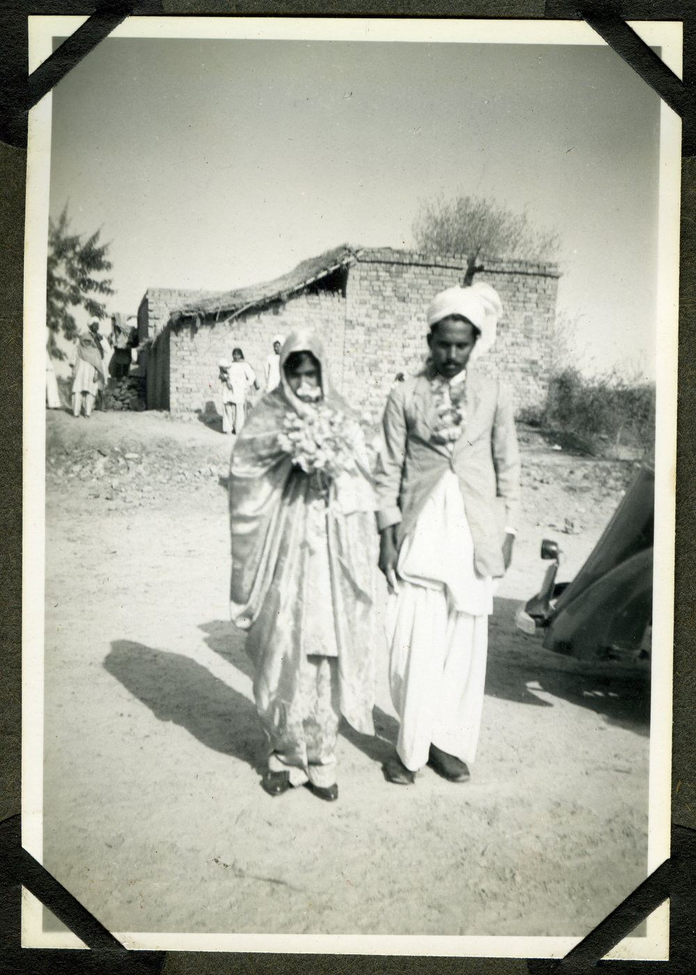 "Wedding Groups,"  an unidentified woman and man walking during a wedding