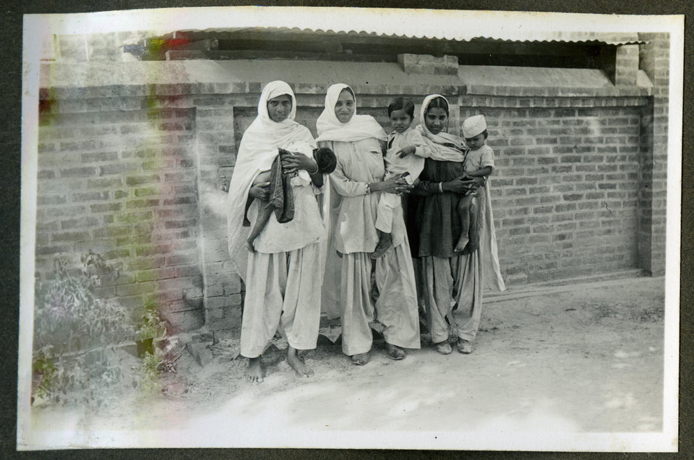 "Munsi, Shankari, Anti," three Indian women holding their Children
