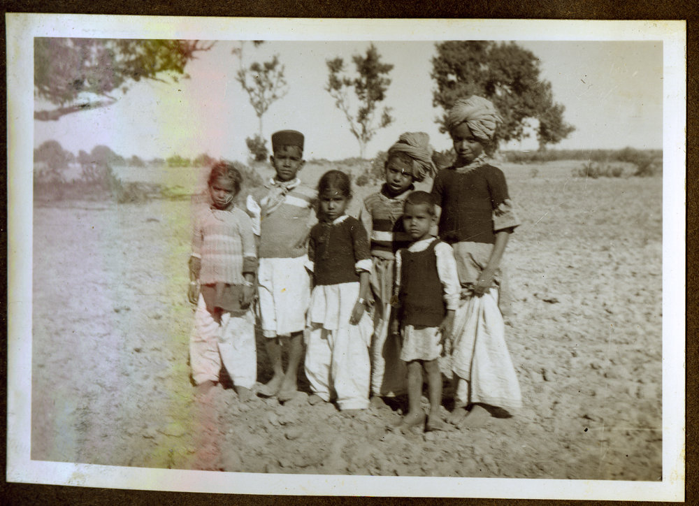 "Woolen vests from N.Z," young Indian children wearing woolen garments 