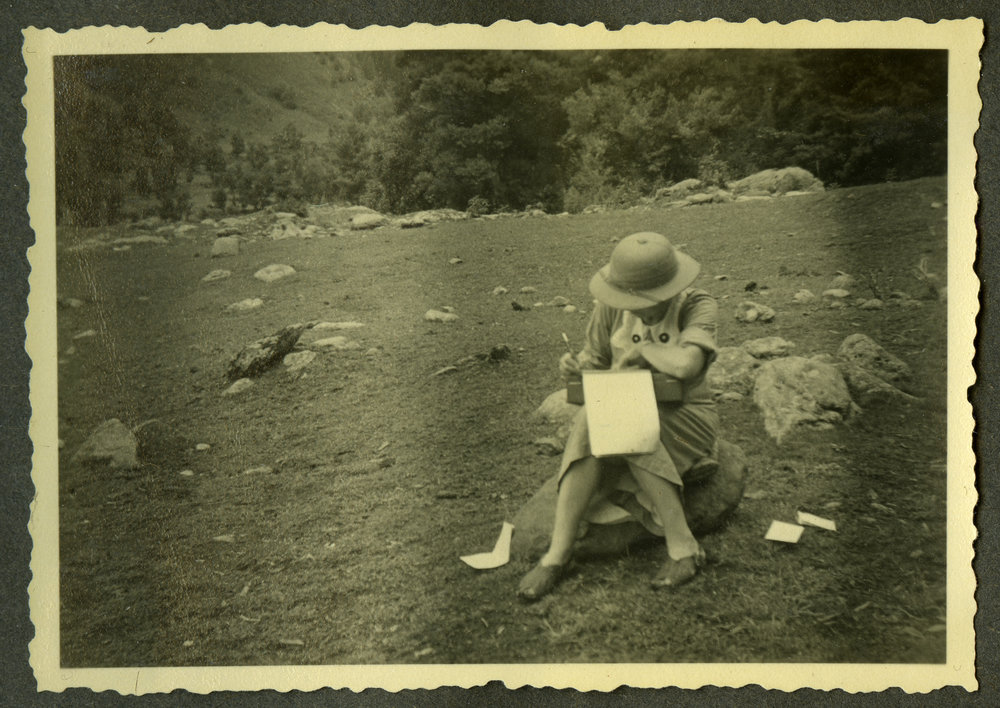 "Home mail," Lorraine E. Saunders writing a letter