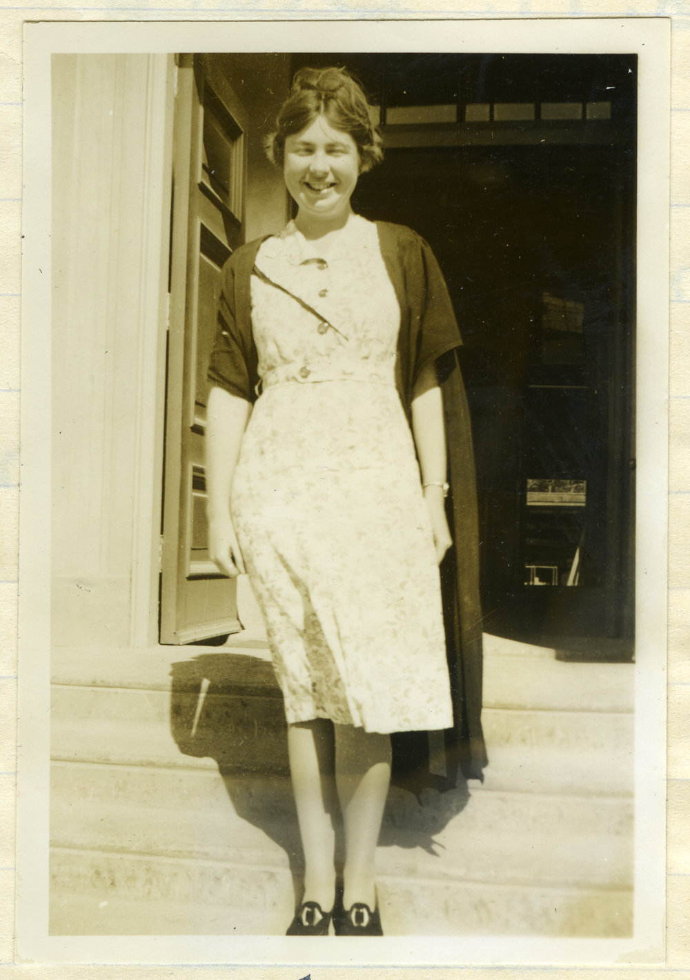 Miss Trevena, standing on steps