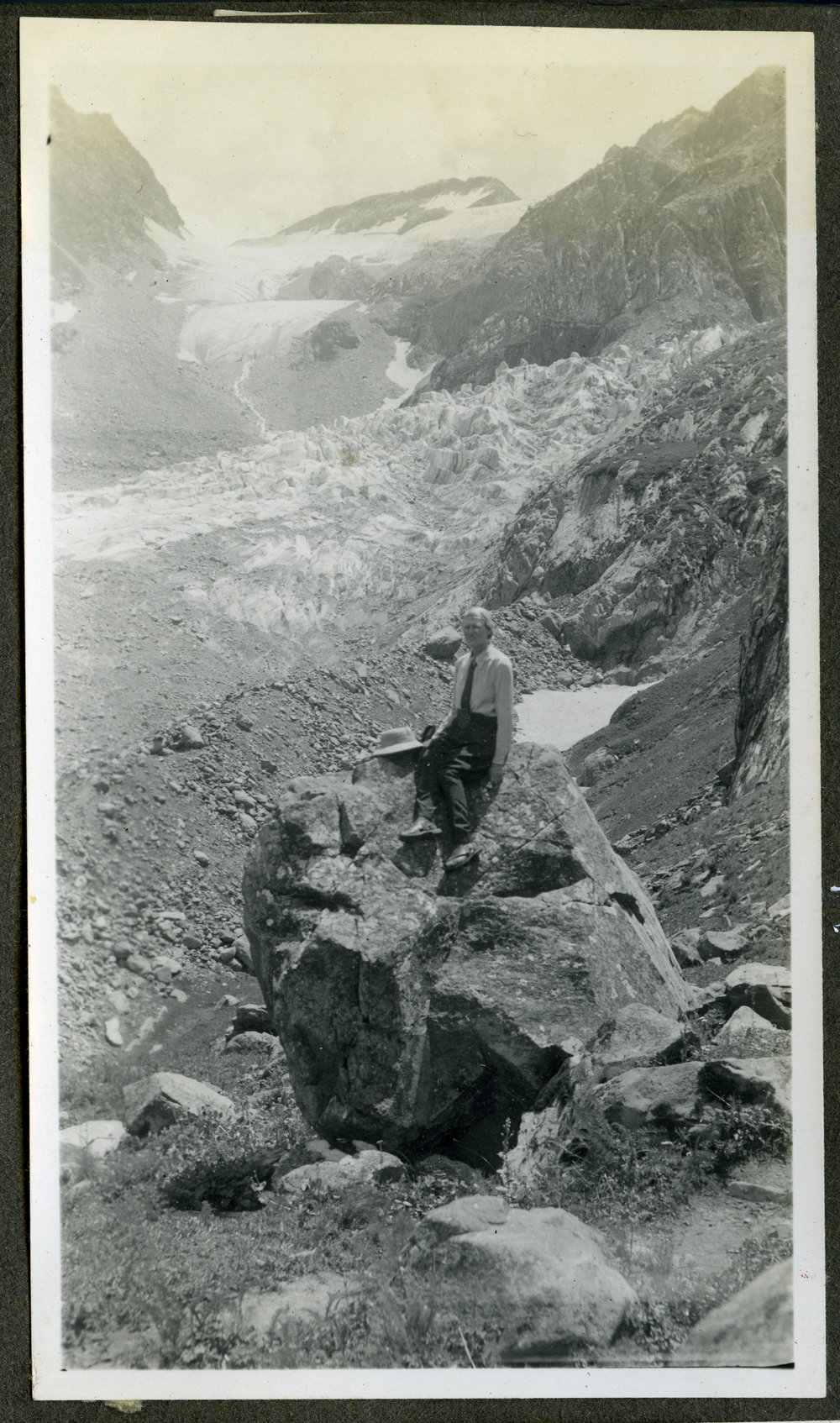 "D. M at Kalahai," seated on a boulder, India