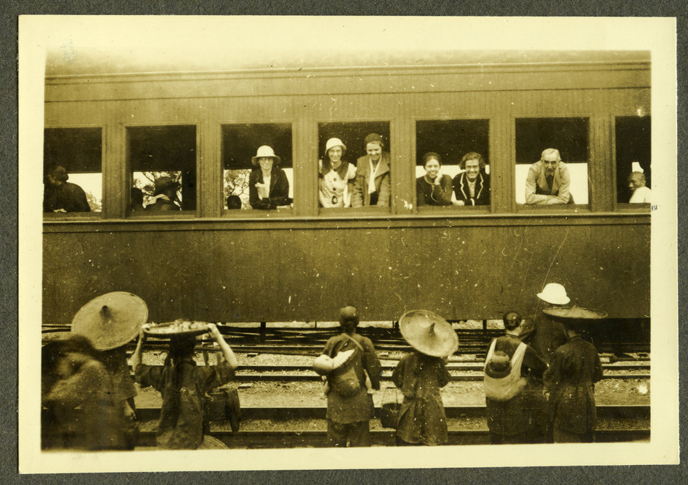 "On way to Buddhist Monastery," female missionaries leaving on a train