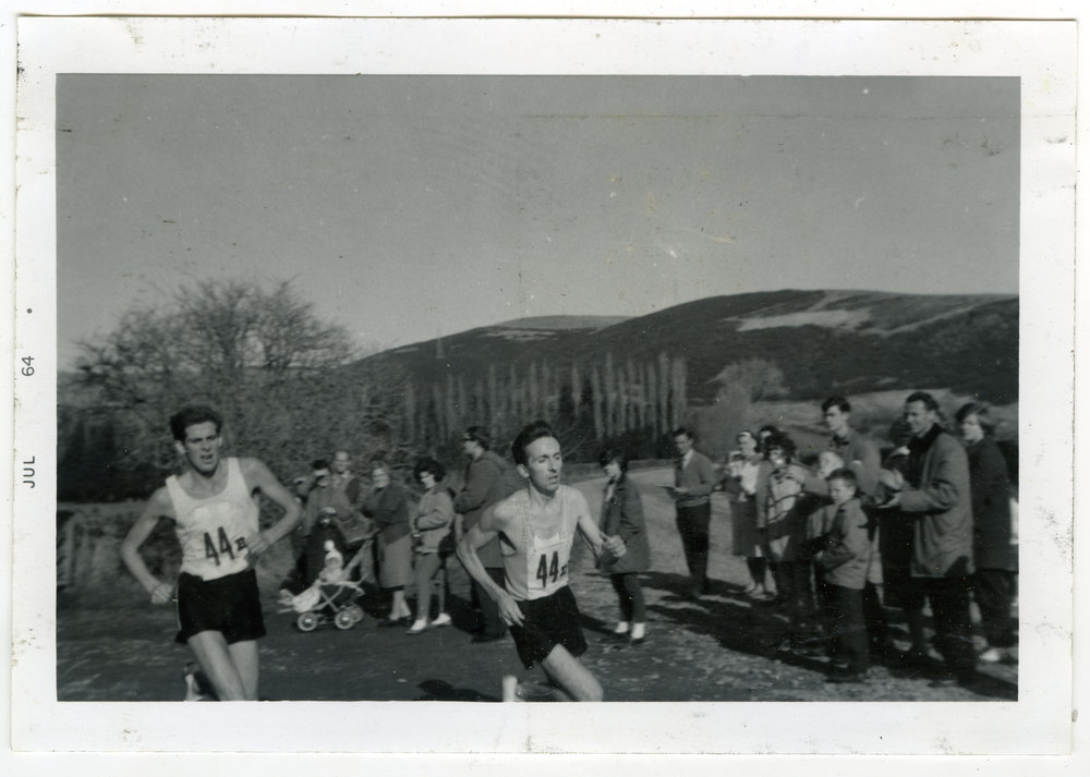 "Duncan Dempsey (16th) and Robin Gilchrist (15th) with 100 yards to go, St. Andrew's Trophy, Christchurch 1964, Presbyterian Harrier Club - Wellington 