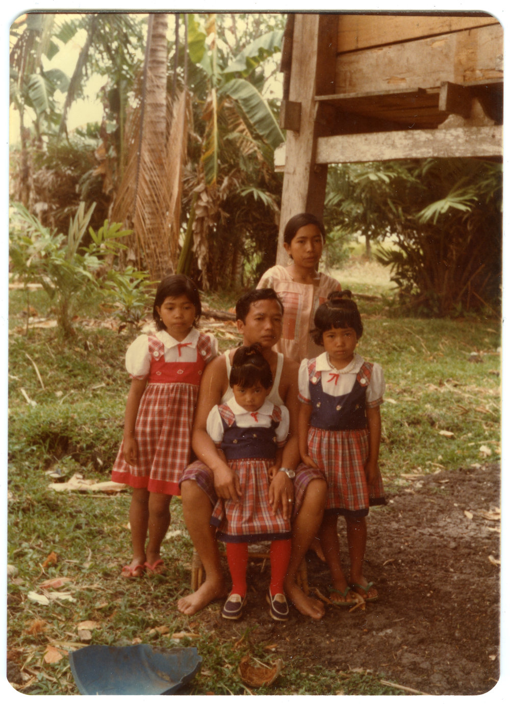 Ruben Kapa with Children, Outside the Home of His Parents