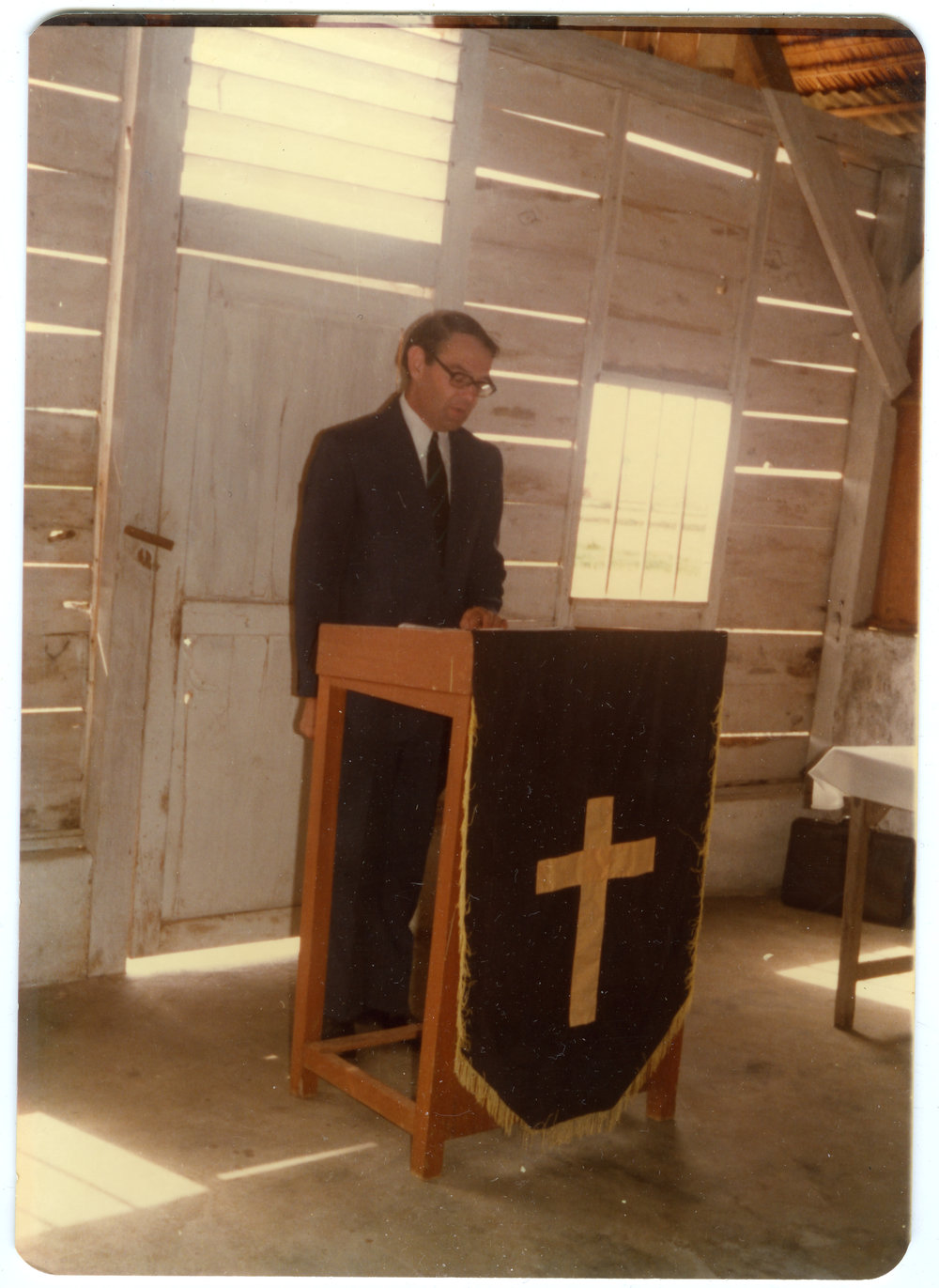 Robert Patterson at the Lectern in the Morning Church Service at Ujung Lamuru