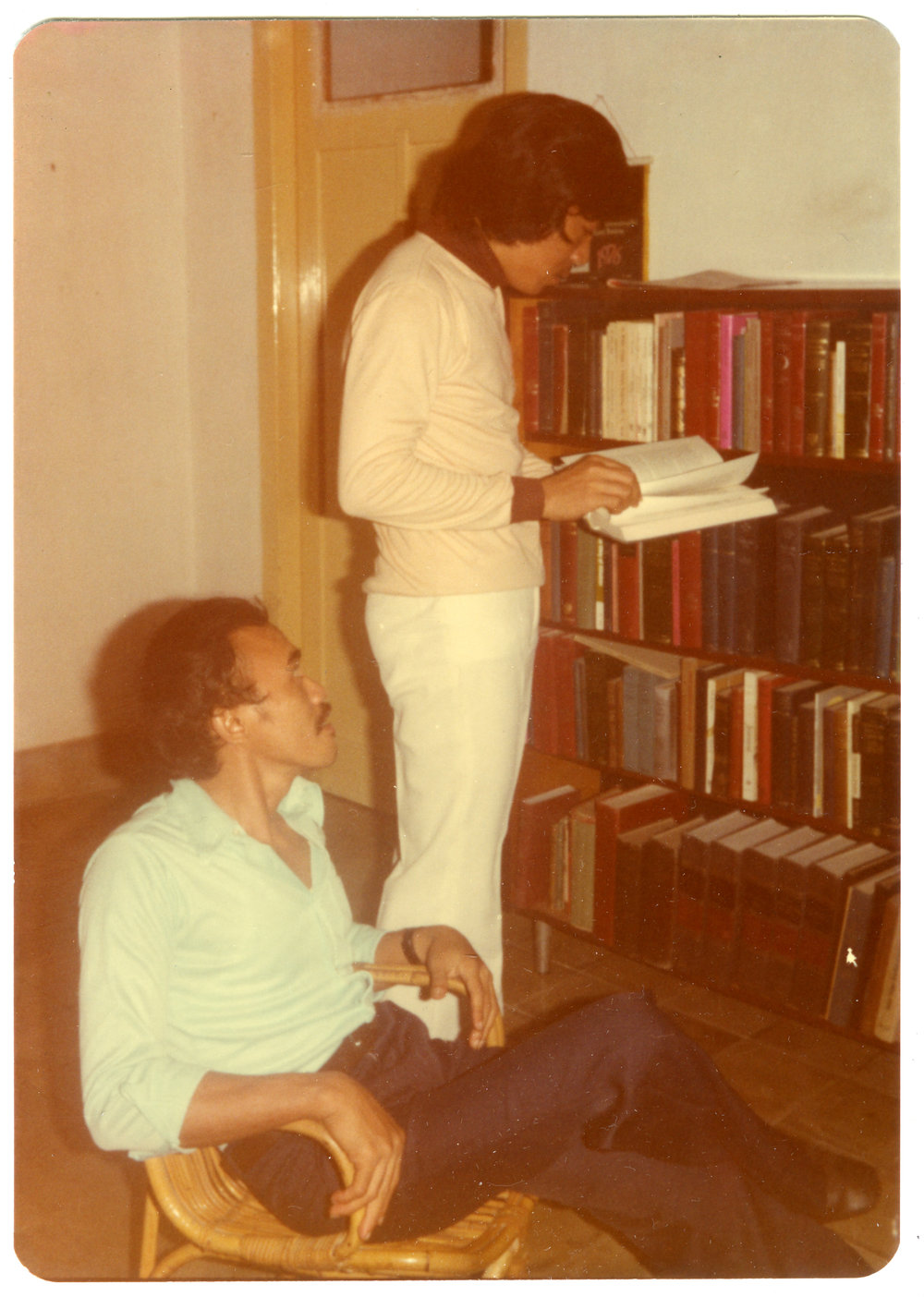 Johny Ogelang and Djalindu Bintela in Front of Robert Patterson's Bookcase