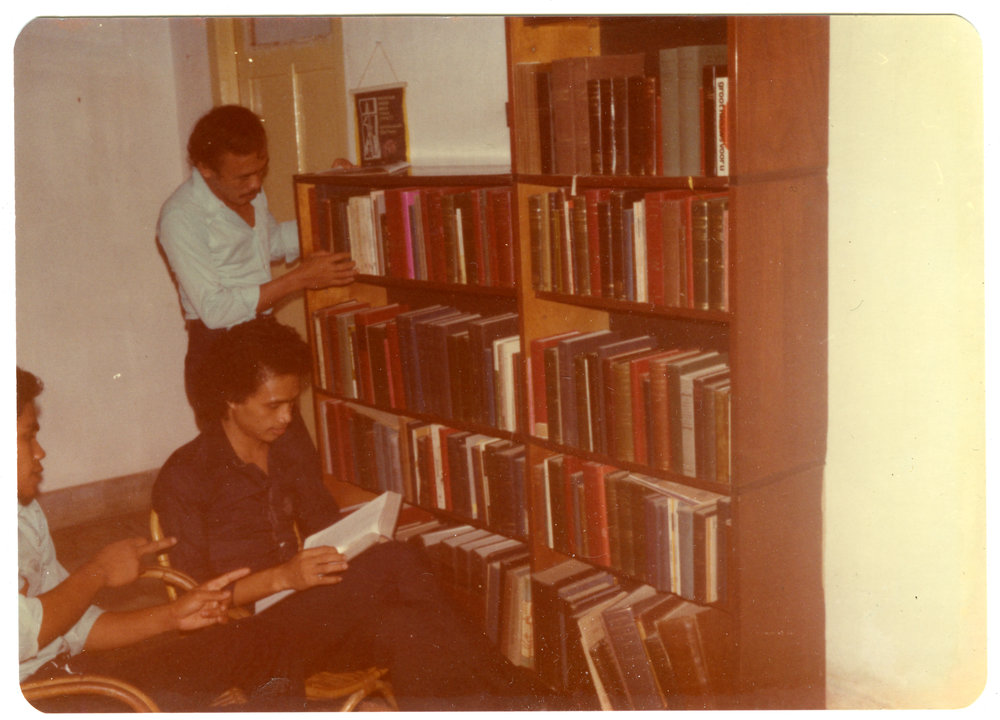 Some Tingkat 4 Students in Front of Robert Patterson's Bookcase
