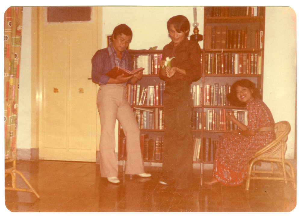 Nius Mbatono, Sergius Paul Sangkide and Emma Lazarus in Front of the Bookcase
