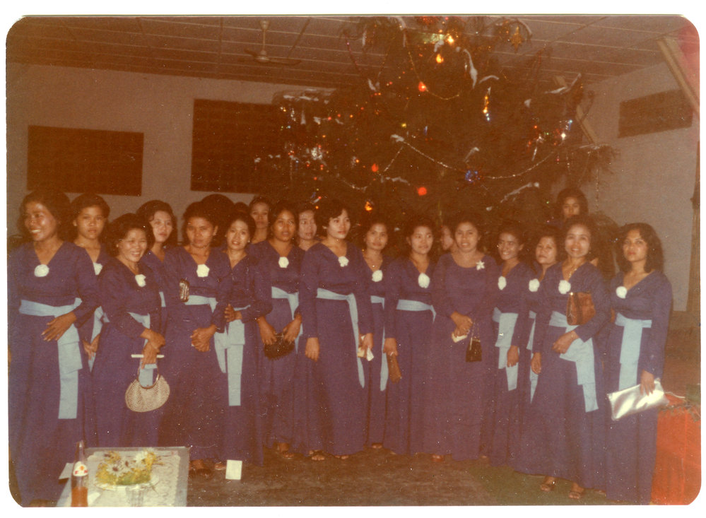 Members of the Women's Choir in Front of the Christmas Tree