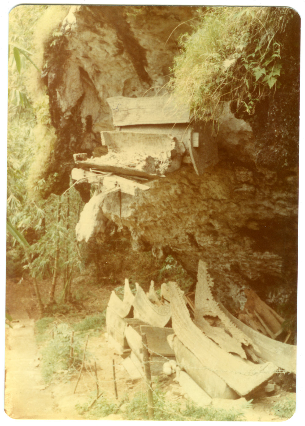Coffins on a Wooden Ledge at Kete