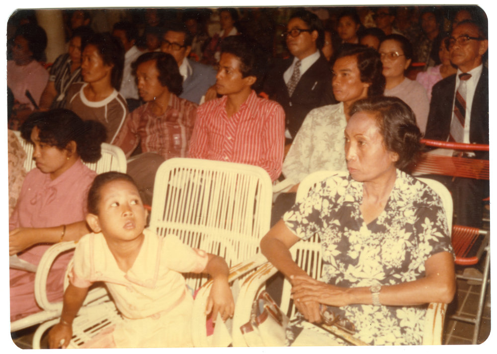 Group of People Sitting Inside a Hall