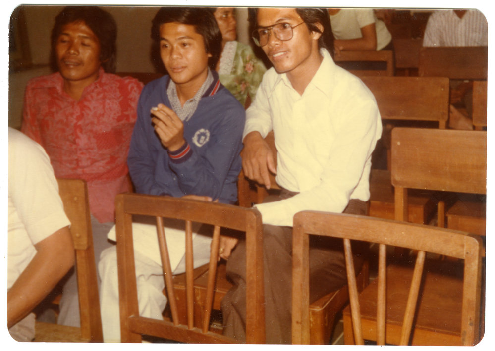 Three Students Sitting in a Hall