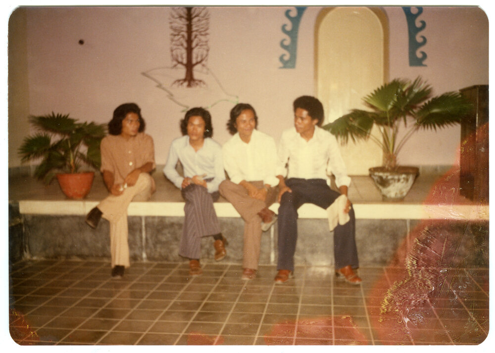 Group of Students Sitting on a Bench