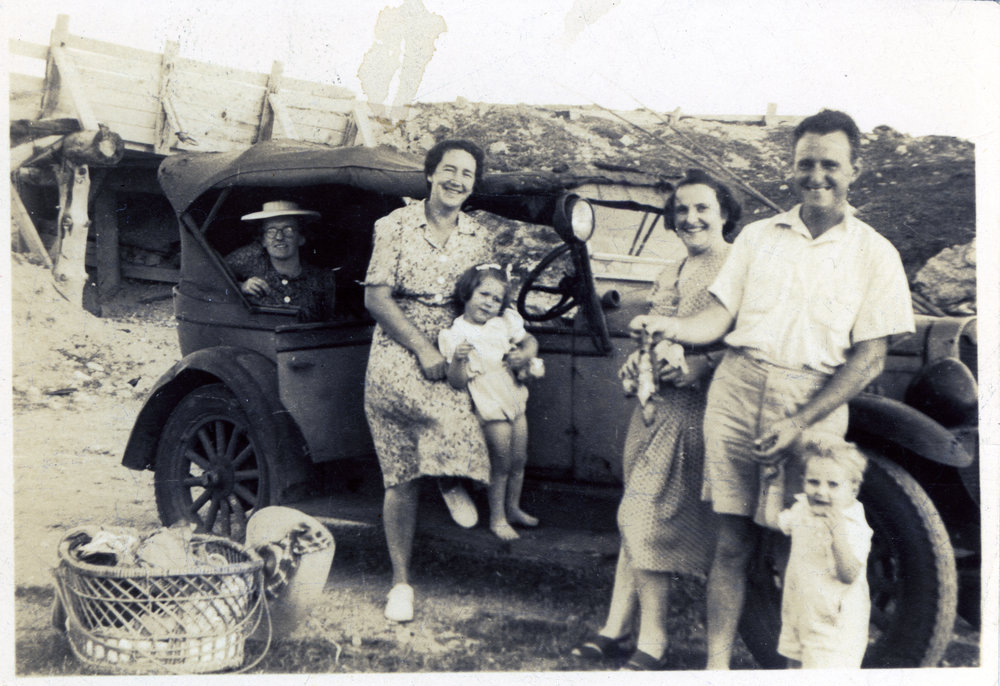 Group photograph by car
