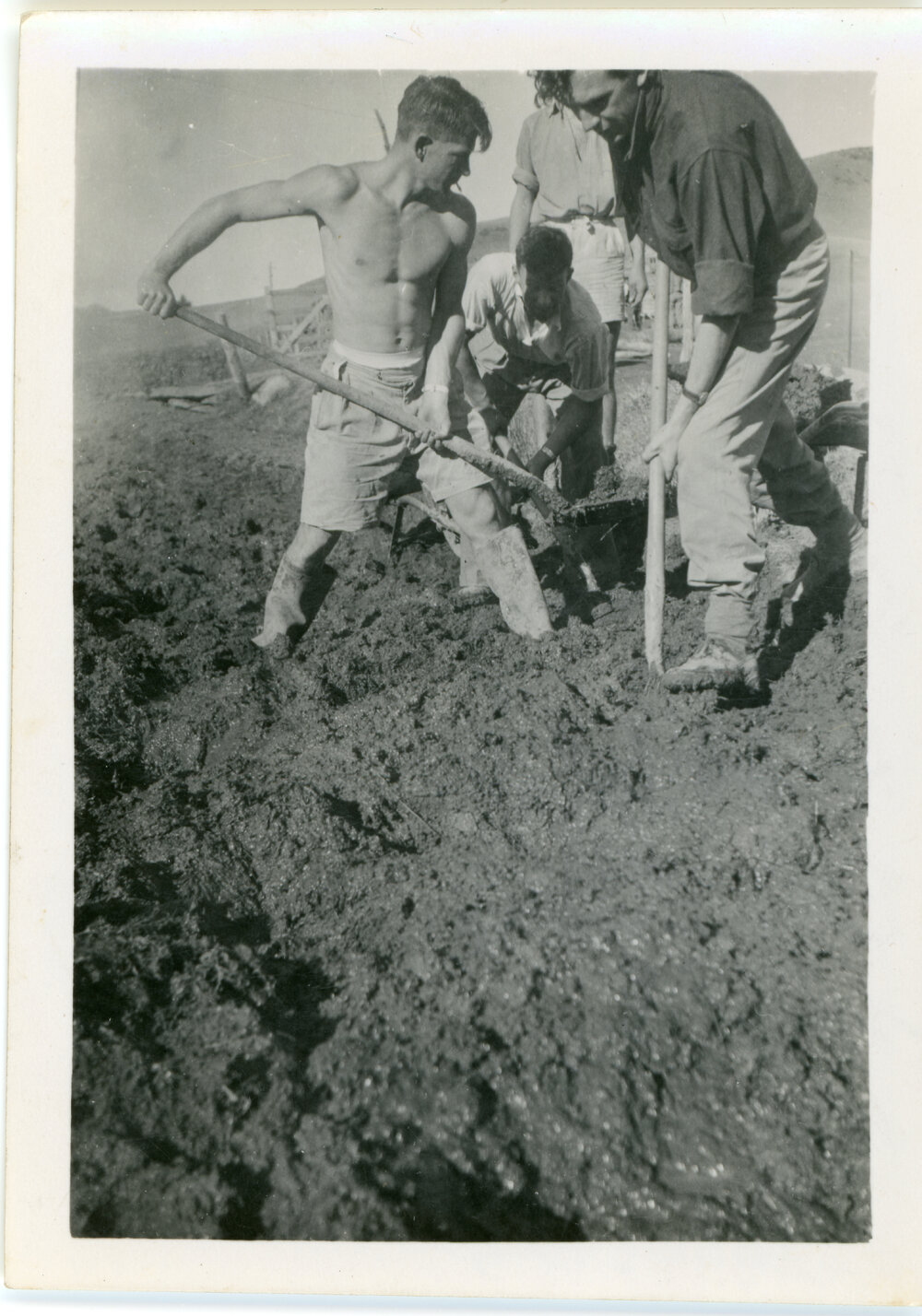 Volunteers moving mud to build Morrisons Church