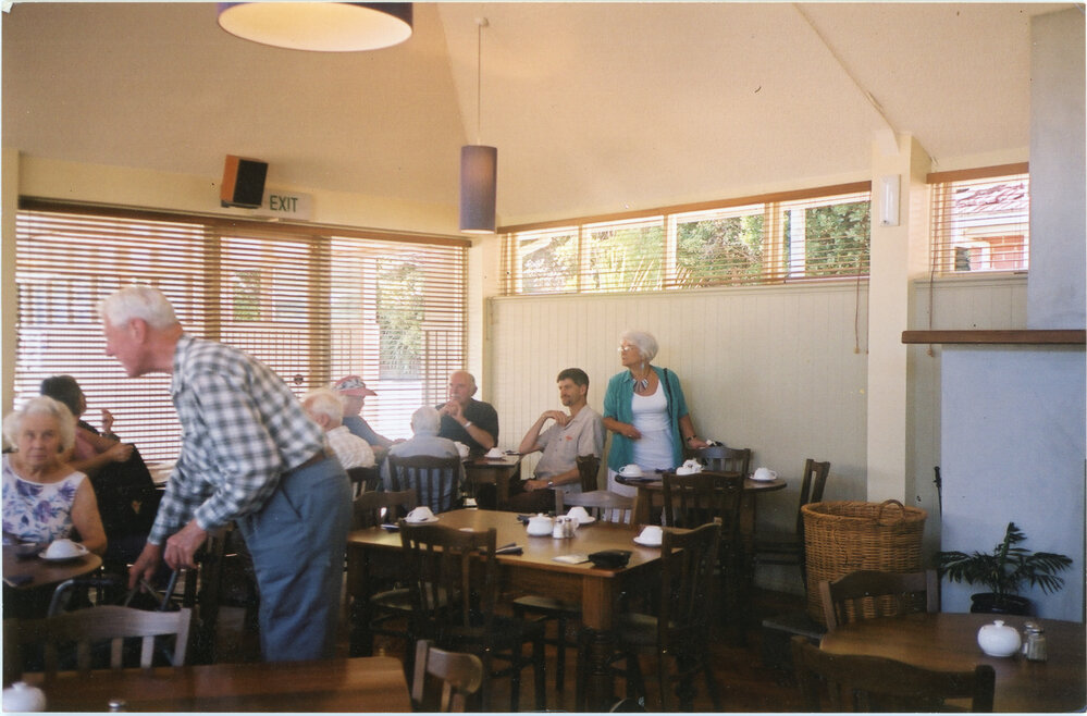 Wadestown Parishioners sitting at table in the Hall