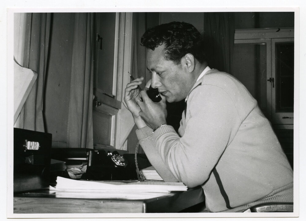Rev Pio Sovala (Bill) Field answering the telephone