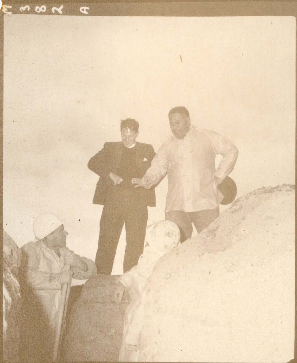 Four Men At A Construction Site