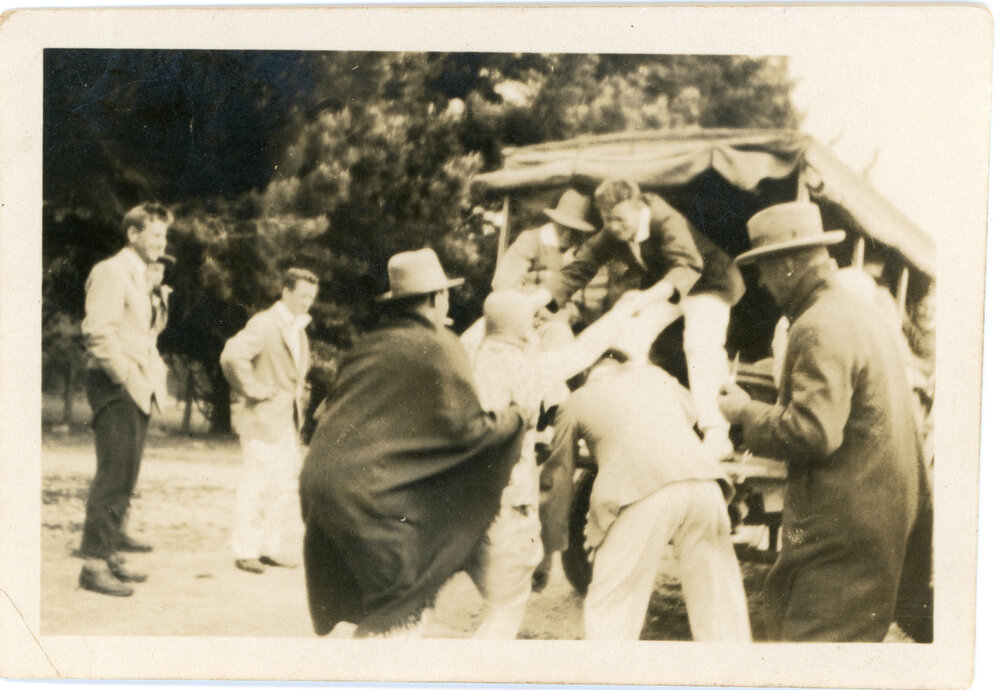 Unknown Group Climbing Into a Truck
