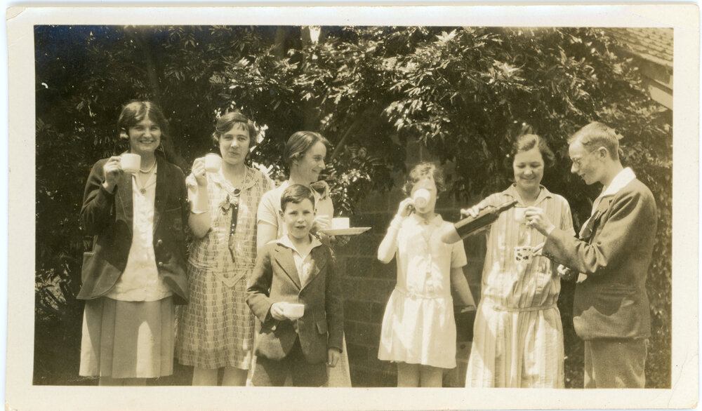 Seven Young Adults Enjoying a Garden Party