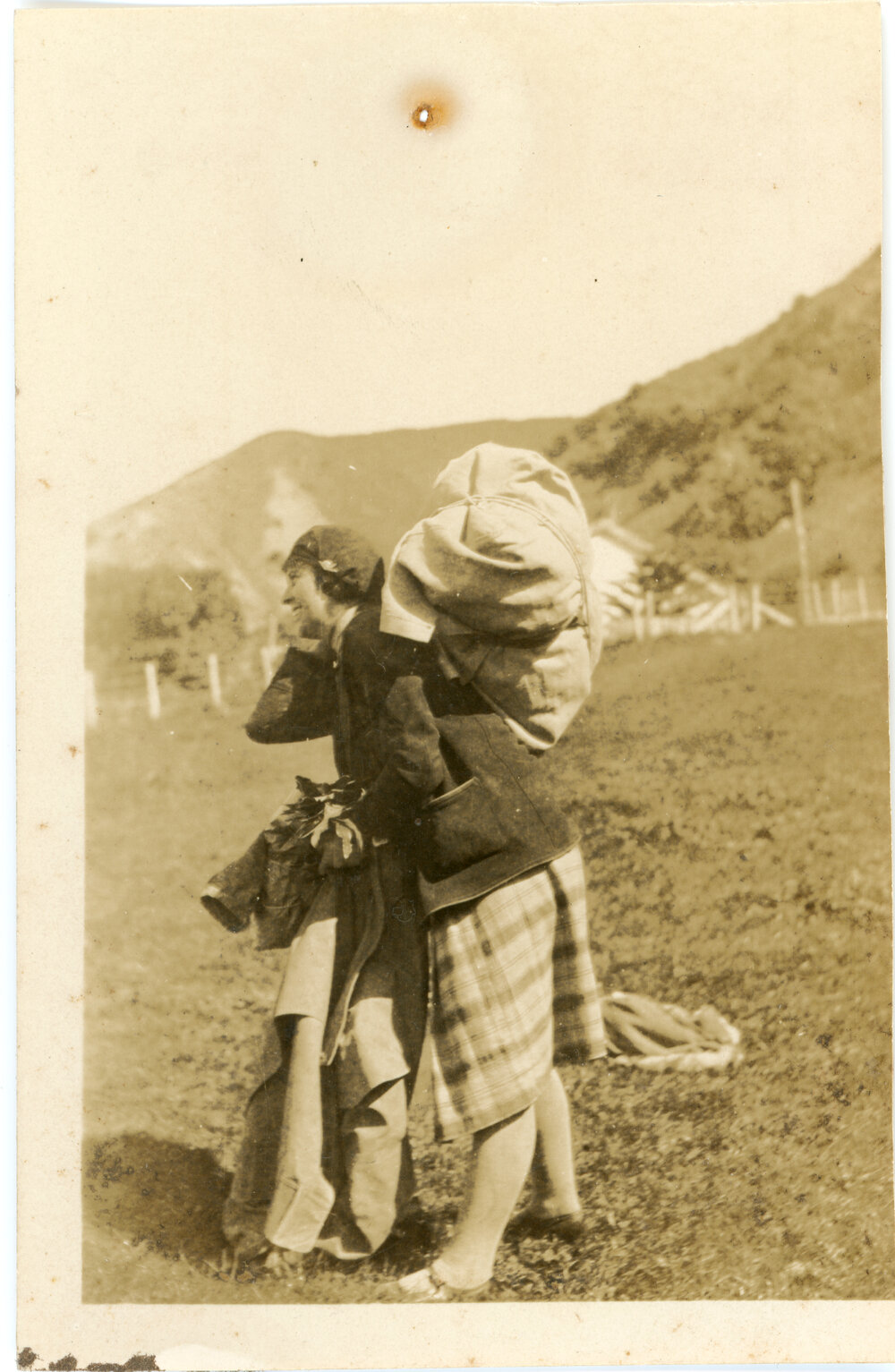 Unknown Woman With A Pack On Her Back