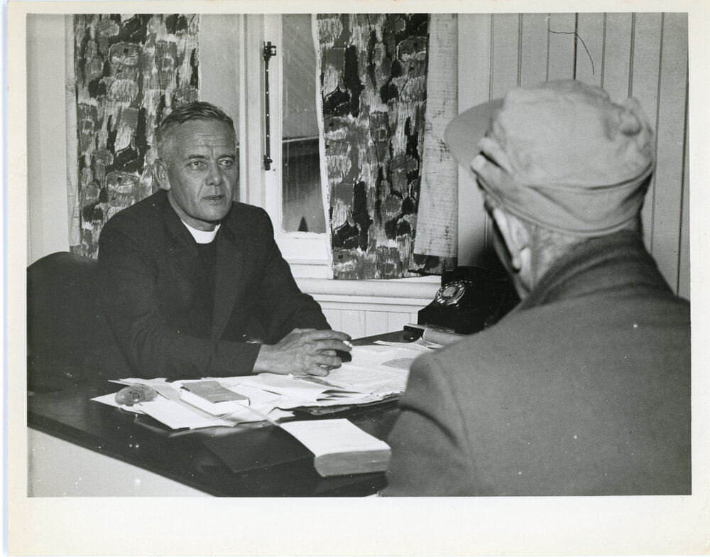 Minister In Conversation At His Desk