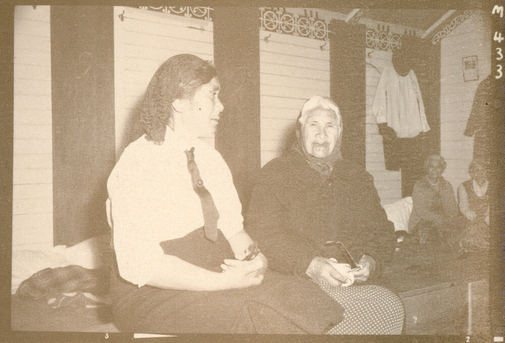 Two women in meeting house