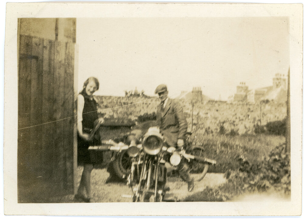 Two People and a Motorcycle In Scotland